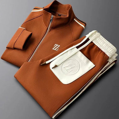Folded brown tracksuit with a logo on a gray background