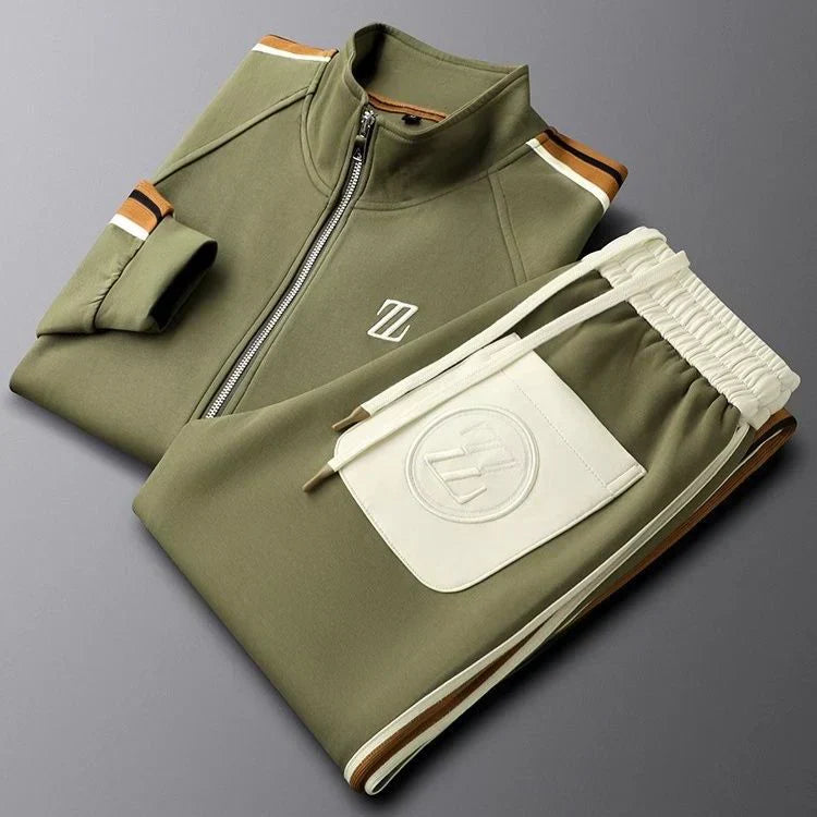 Folded green tracksuit with a logo on a gray background