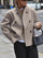 Loose-fitting jacket with button closure for women