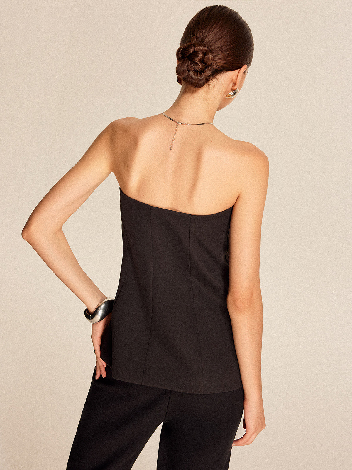 Strapless top met knopen aan de voorkant