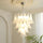 Lustre en verre blanc de luxe en forme de plume