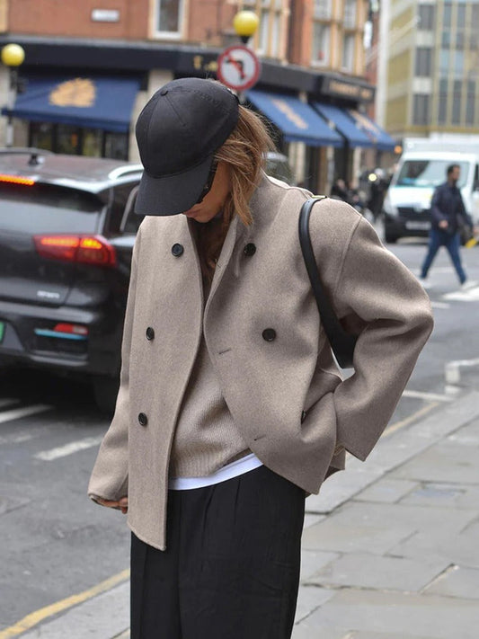 Women's jacket with stand-up collar and button closure